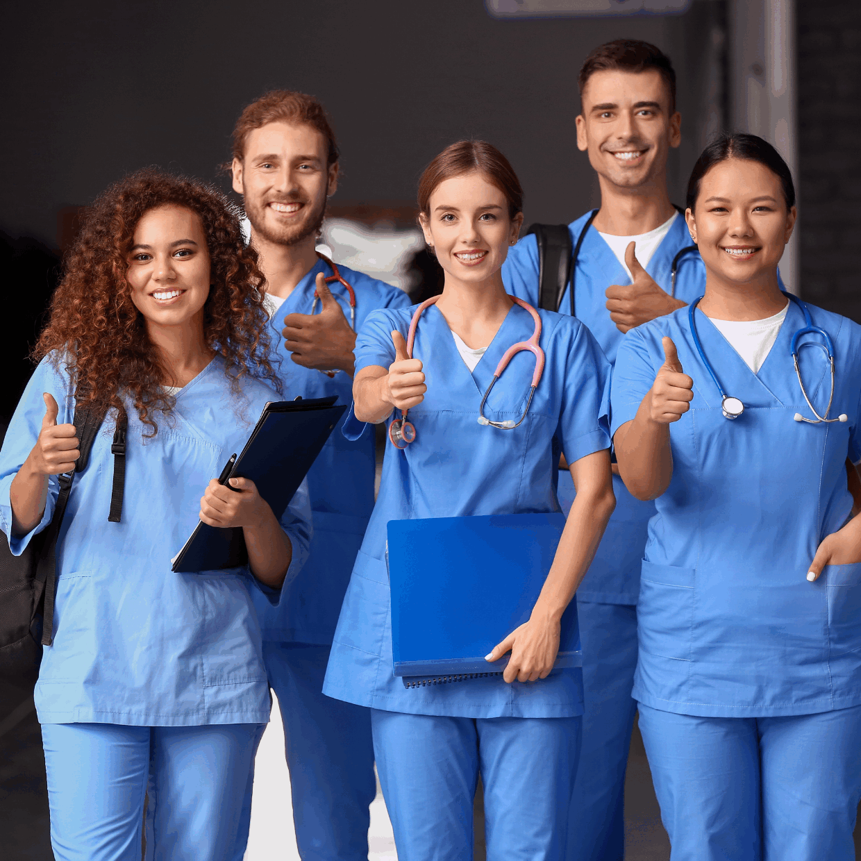 Healthcare manager reviewing staff schedules with a clinical team in a hospital